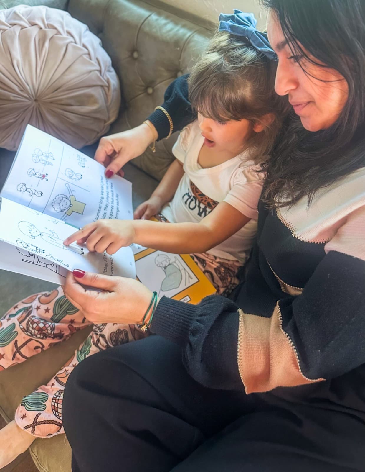 A mom and her daughter working through a DWKD activity together